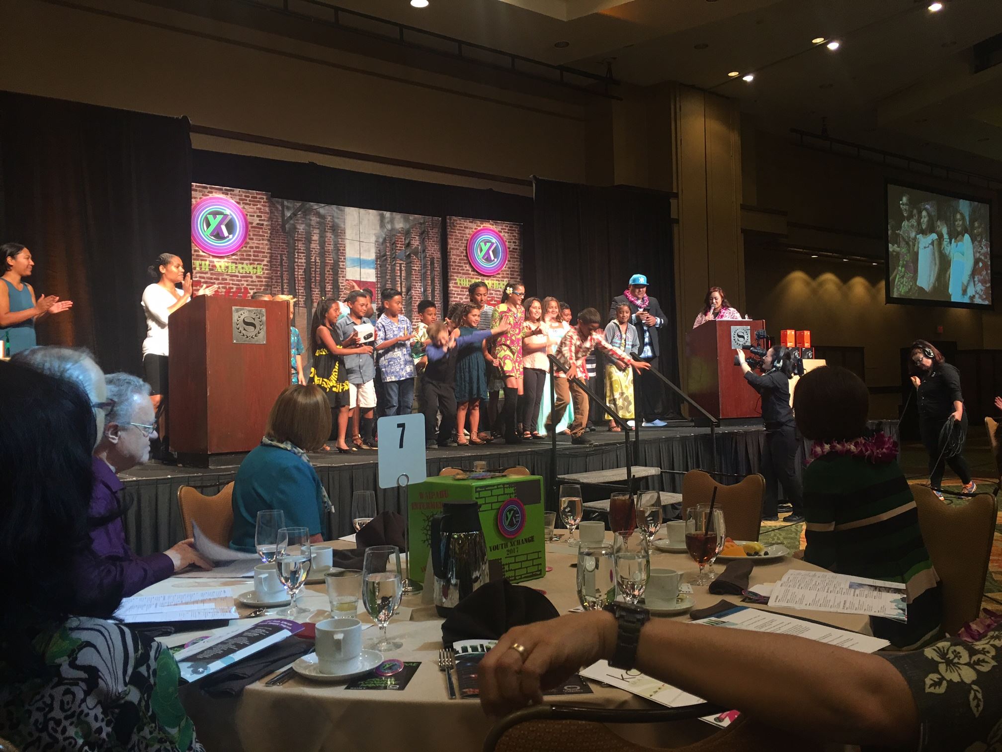 Expo-style booth at an event with attendees