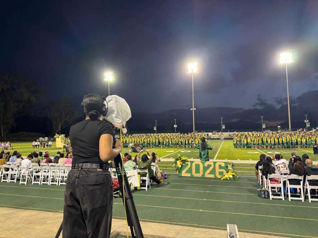 Student camera operator filming the Leilehua graduation